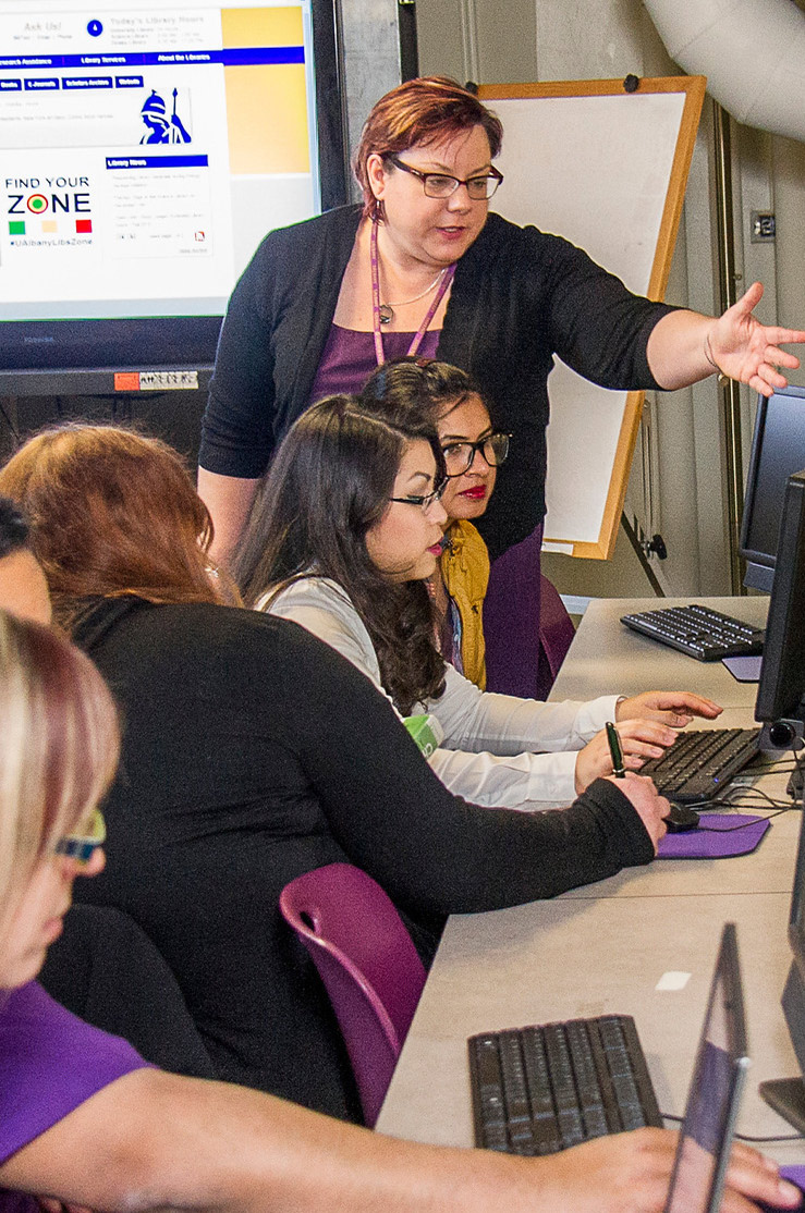 Instructor teaching in library classroom