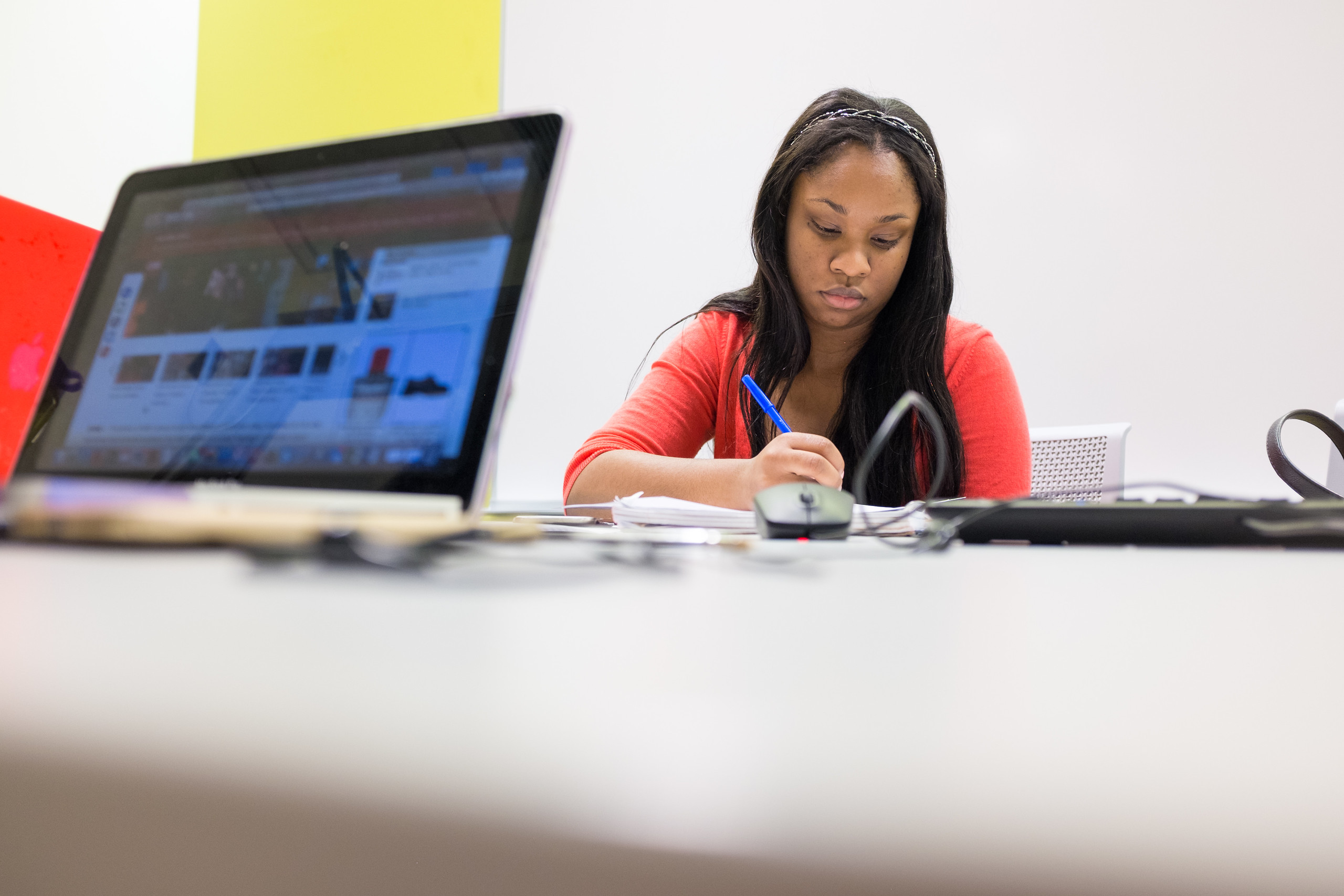 Student works with a laptop open