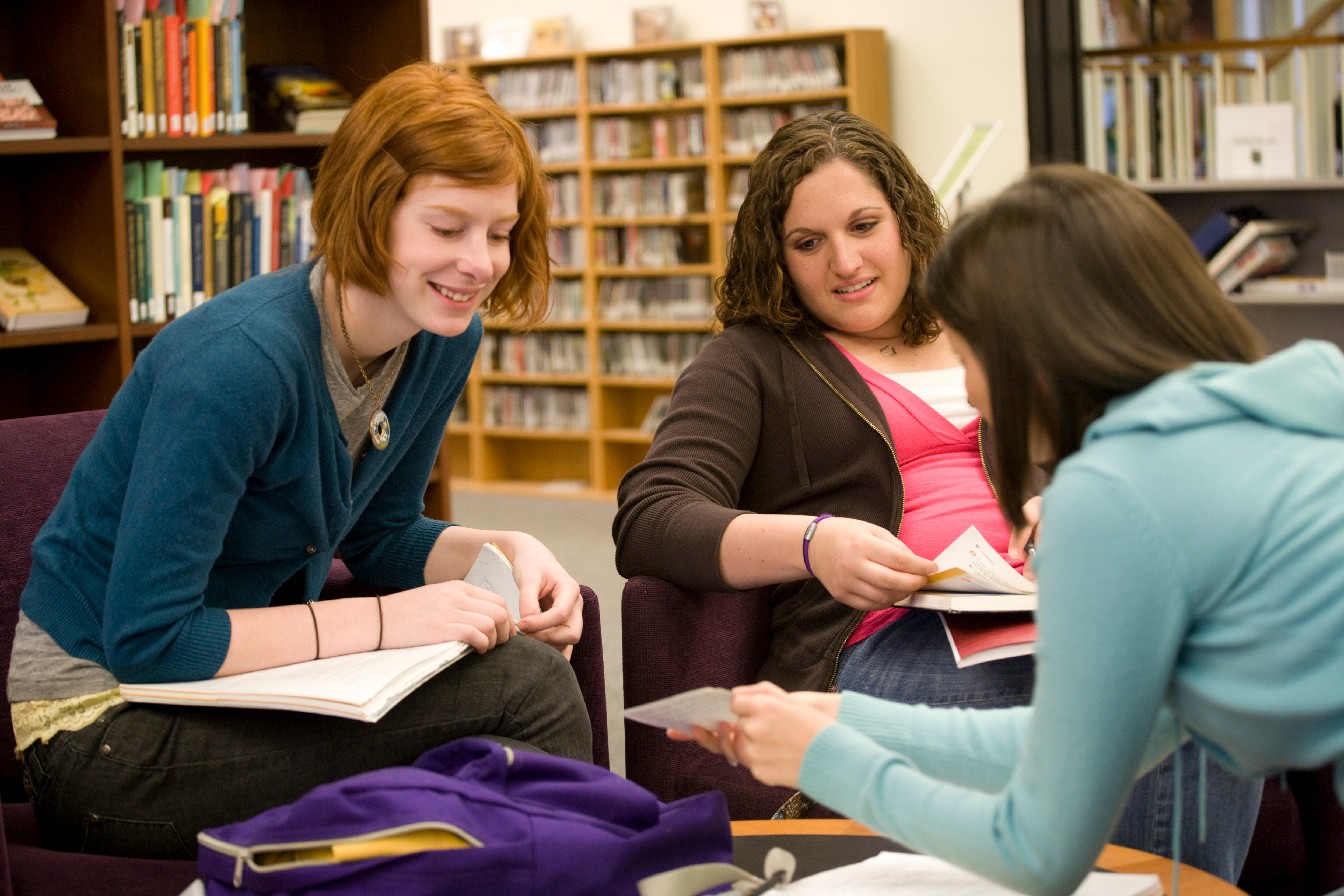 students reading in library