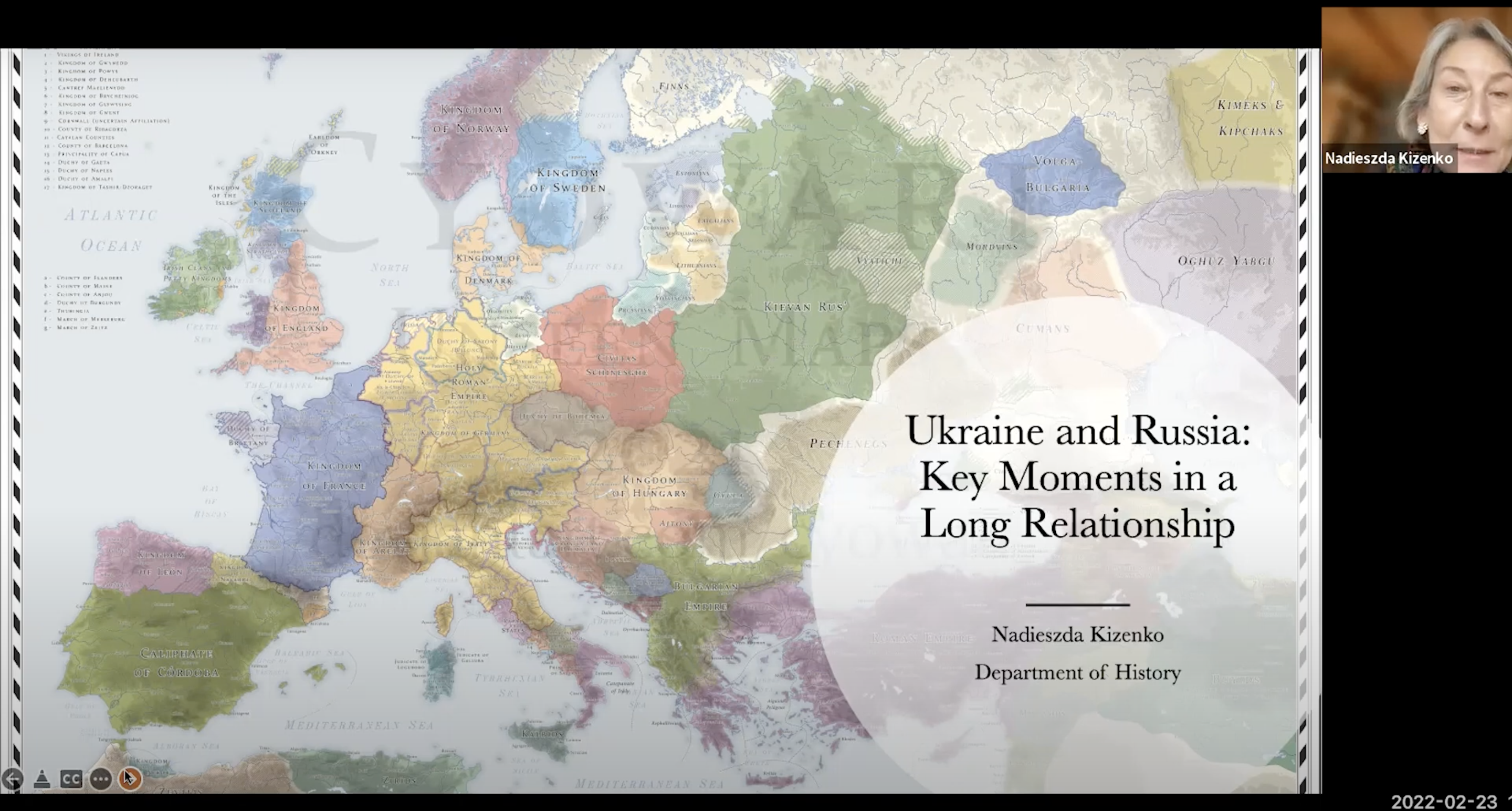 Professor Nadieszda Kizenko lecturing alongside a map of Europe