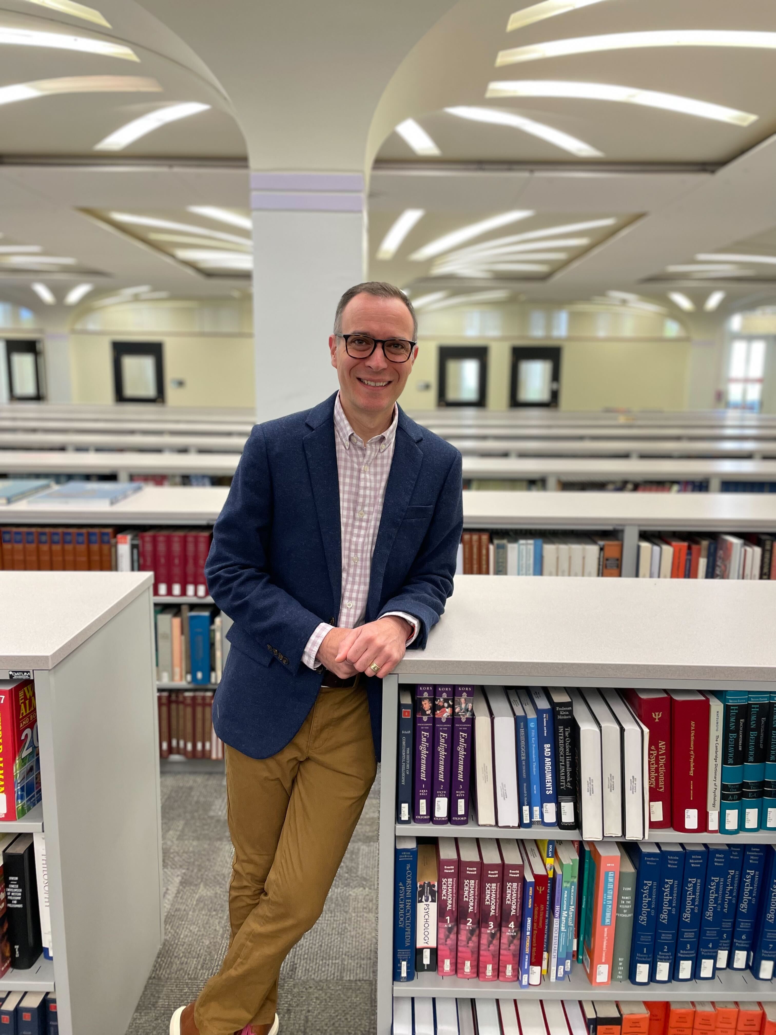 Kabel Stanwicks poses in front of Reference Collection