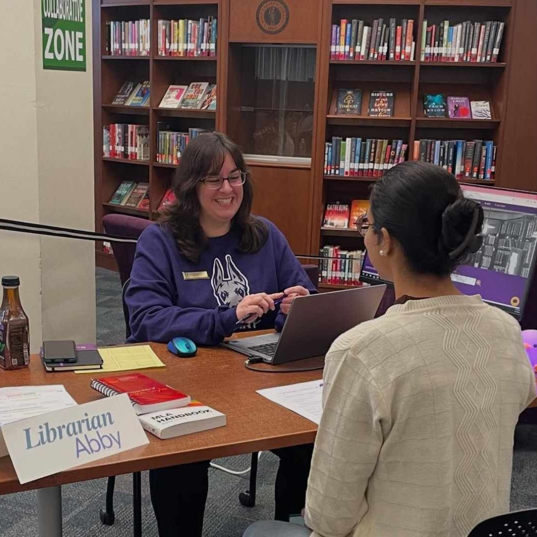 Librarian, Abby Adams, meets with a student at our pop-up reference location