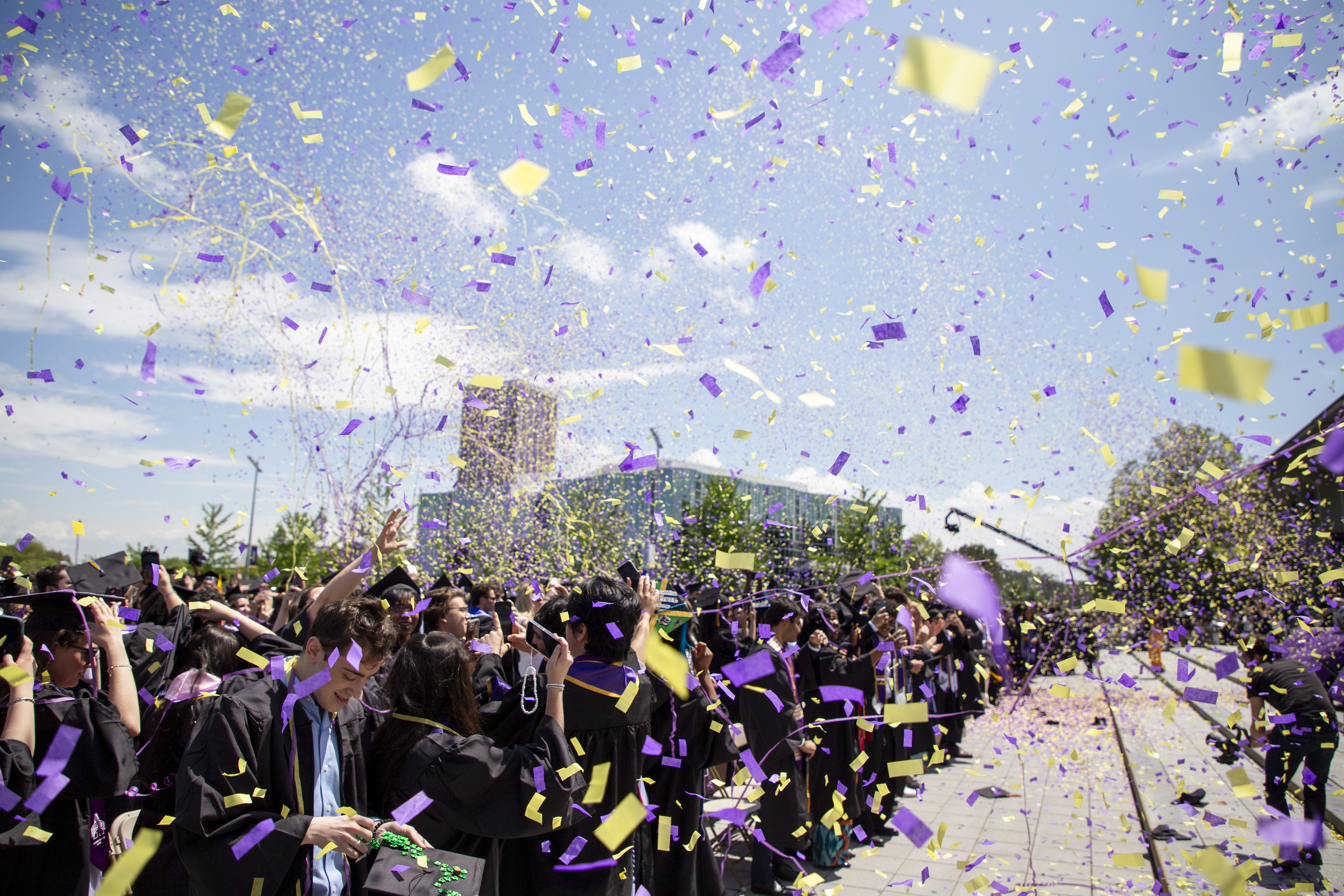 Confetti flying across the air at the 2025 commencement ceremony
