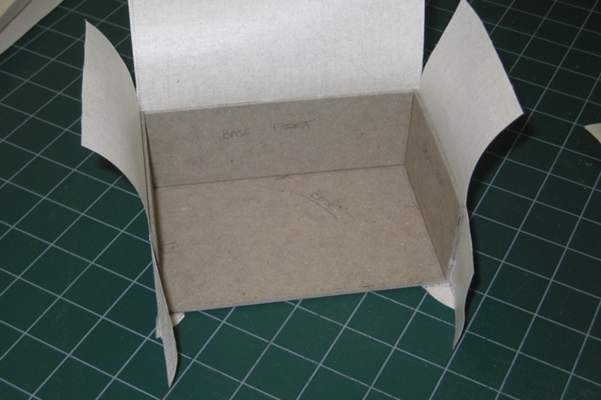 Cutting cloth to cover tray