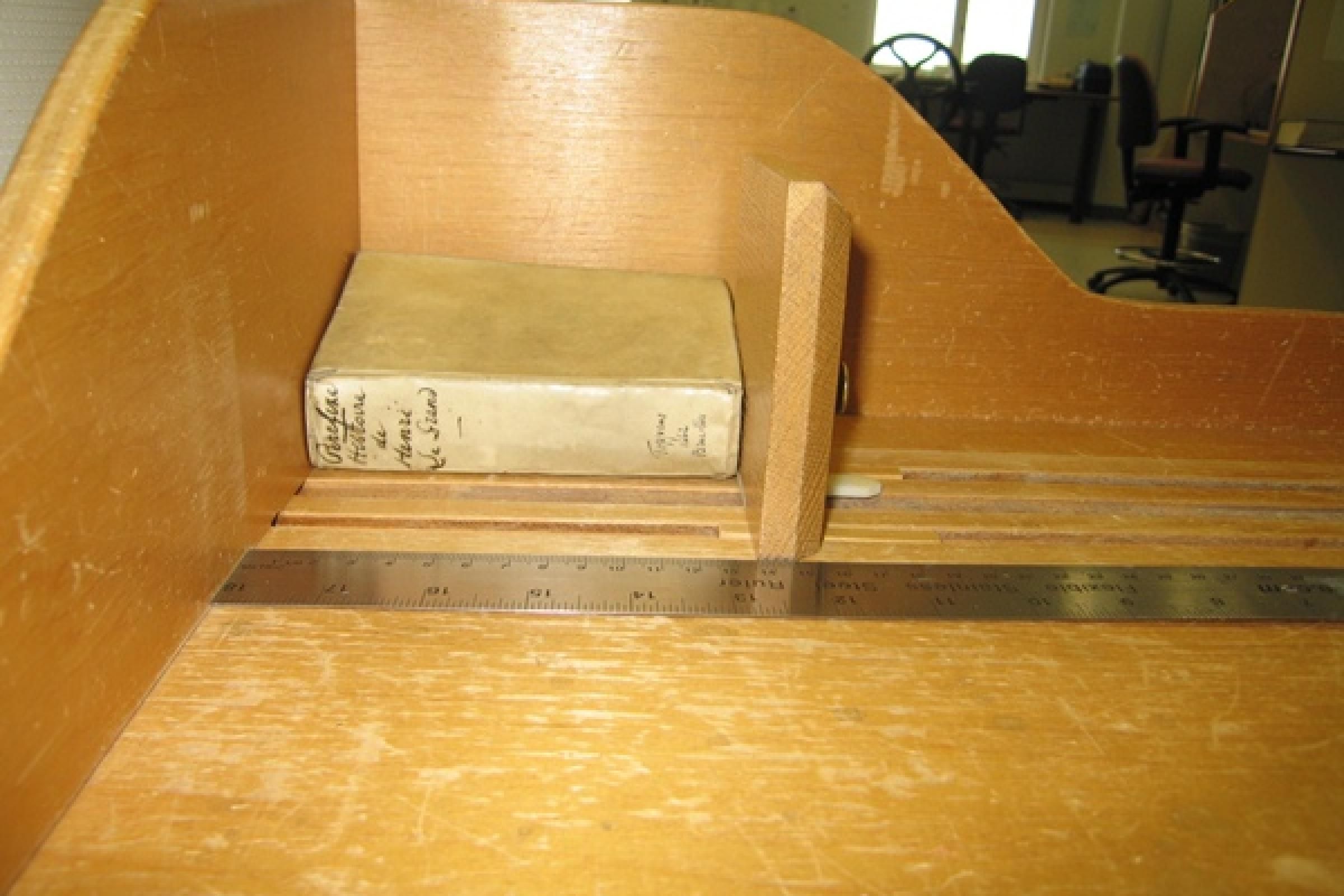Measuring the height, width and depth (each at three separate points) of book
