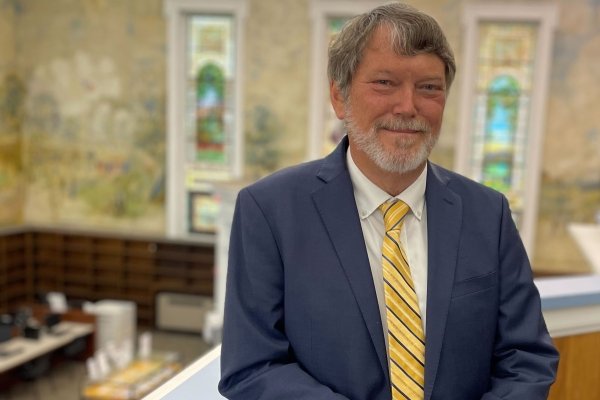 Carey Hatch overlooking the Dewey Library murals