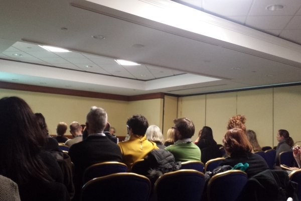 Audience members sitting during a presentation
