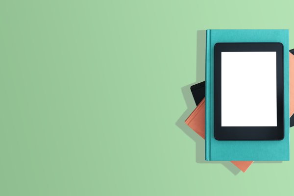 Bright illustration of an eBook reader on top of physical hardcover books.