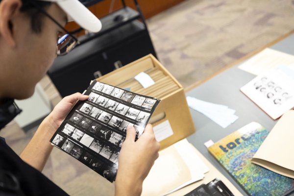 A student reviewing materials from Special Collections and Archives