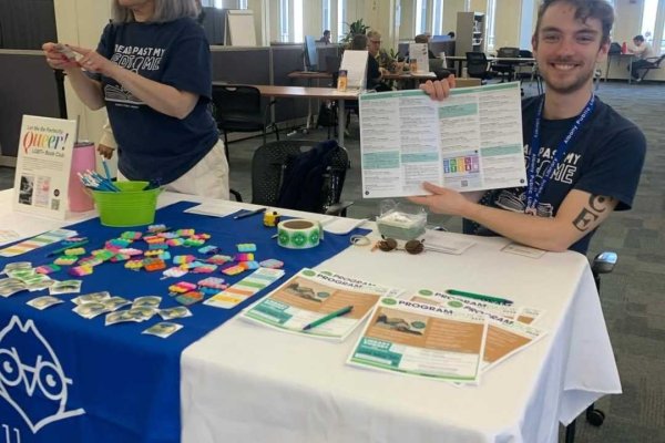 Two staff members from Albany Public Library table at the University Libraries