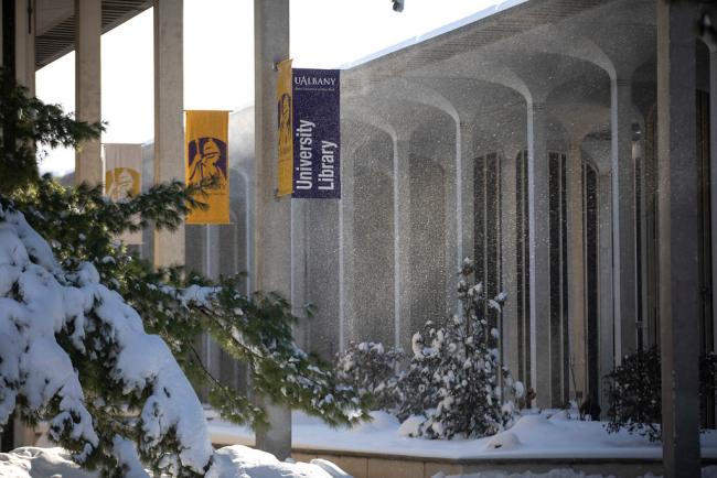 Snow falls on University Library