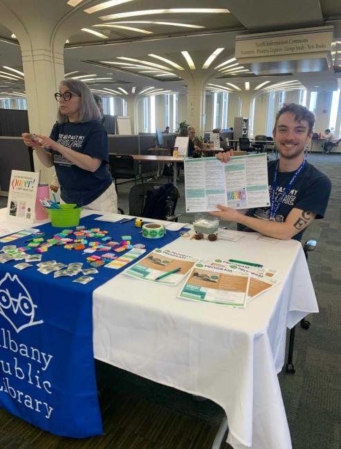 Two staff members from Albany Public Library table at the University Libraries